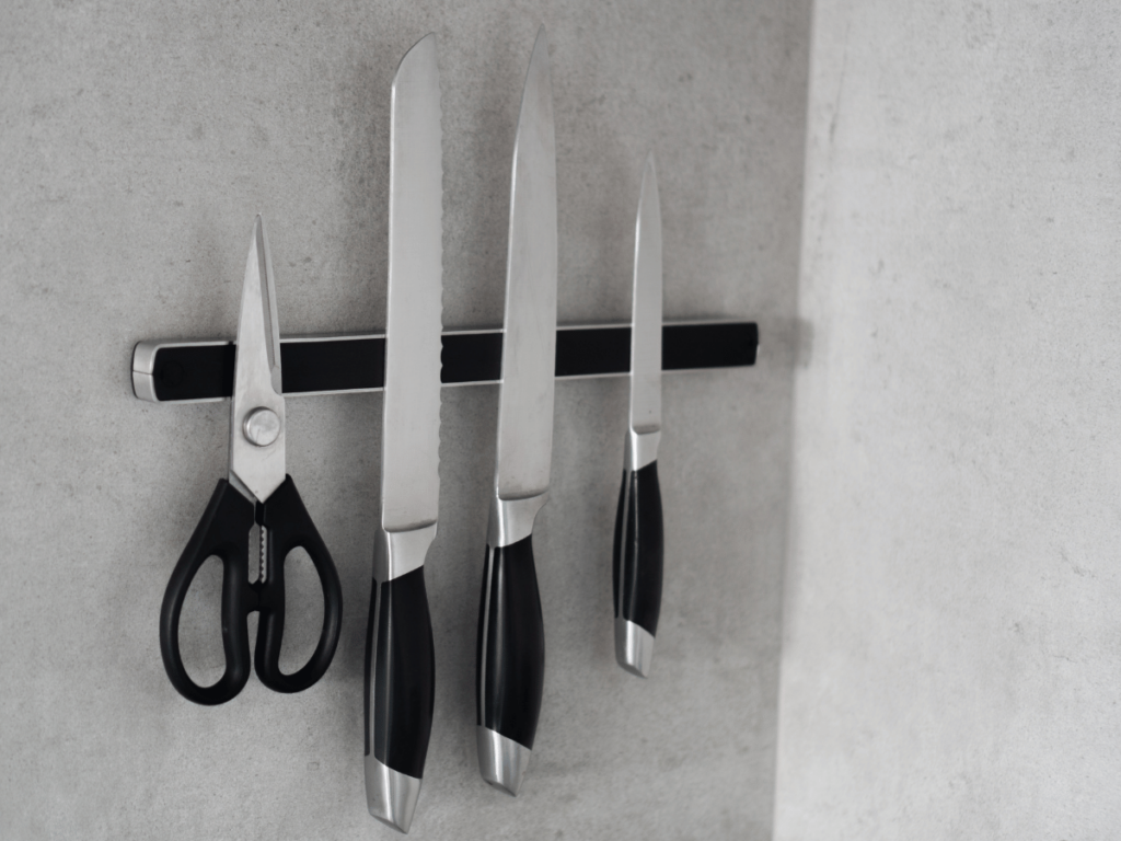 arrange kitchen appliances by using a magnetic strip with kitchen knives & scissors