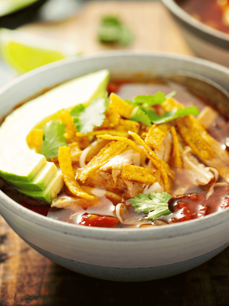 low carb taco soup in a bowl with avocado slices